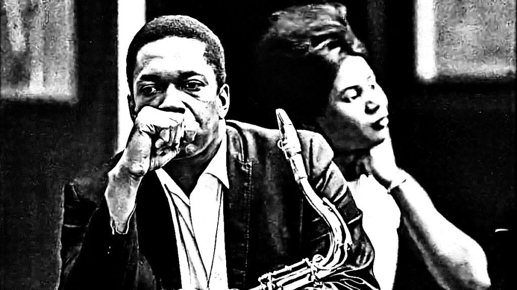 A high contrast black and white photograph of John and Alice Coltrane. John is holding his saxophone and appears deep in thought.