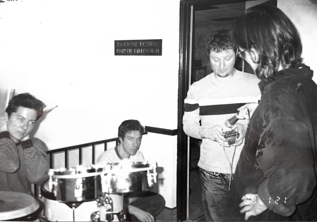 Our friend Sean Patrick Eric Taylor from Seely, Dave Allen playing a small thumb piano, and me with a microphone, at Eighth Dimension Studio in Orlando, Florida, 1998
